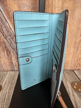 Kate Spade “Staci” Crossgrain Saffiano Slim Bifold Wallet in Bright Sky Blue